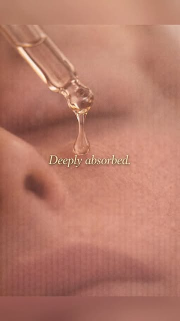 Close-up of a serum dropper above skin from the Skinique reel